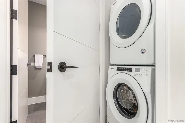 a close view of a utility room with dryer and washer