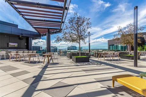 a view of a patio with swimming pool table and chairs