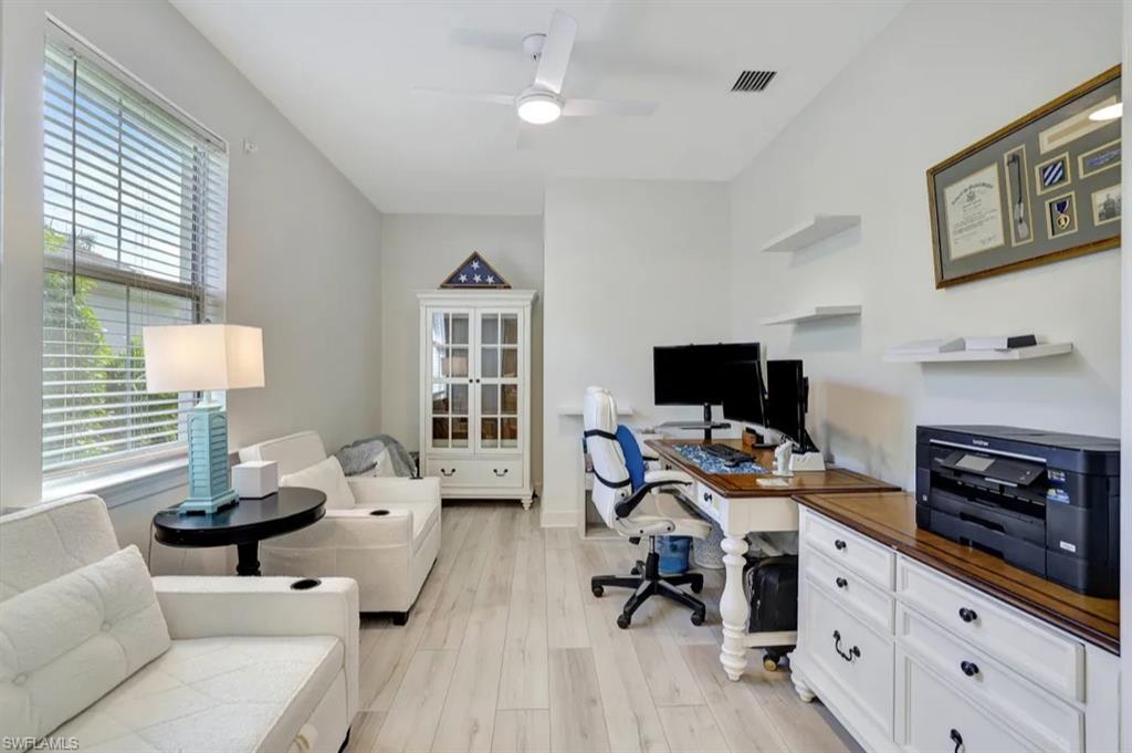 20183 Torch Key Way Estero, FL 33928 - Photo 15 of 30 Office area with light wood-style flooring, plenty of natural light, and ceiling fan and french doors