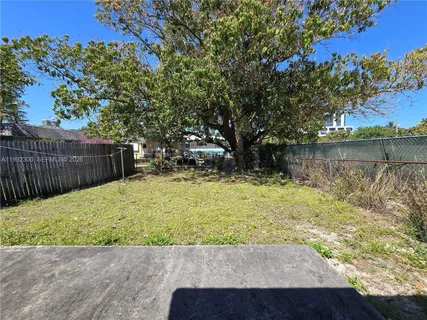 a view of a backyard with green space