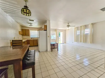 a view of a livingroom with furniture nad wooden floor