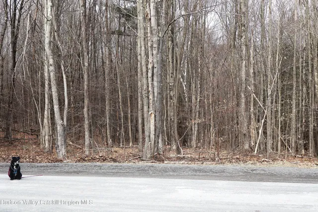 a view of a door with a bench in the background
