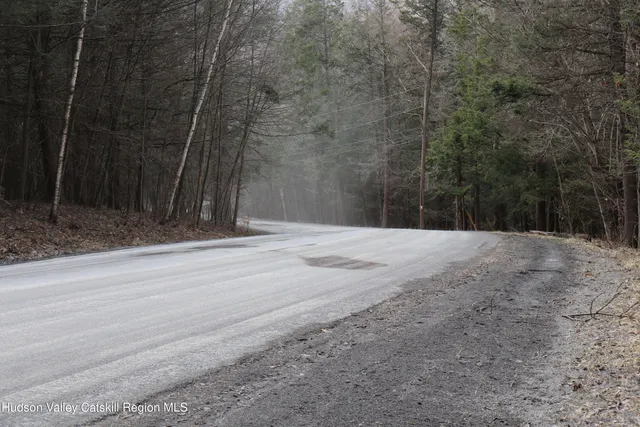 a view of a backyard of the house