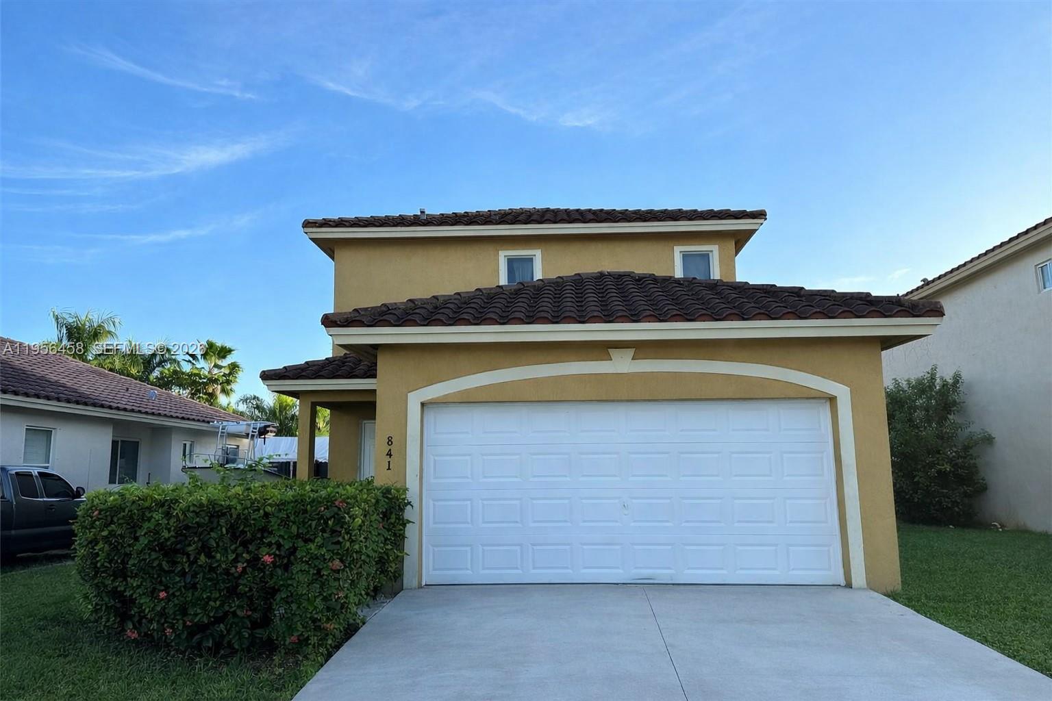 841 Southwest 6th Street Florida City, FL 33034 - Photo 1 of 5 a front view of a house with a yard