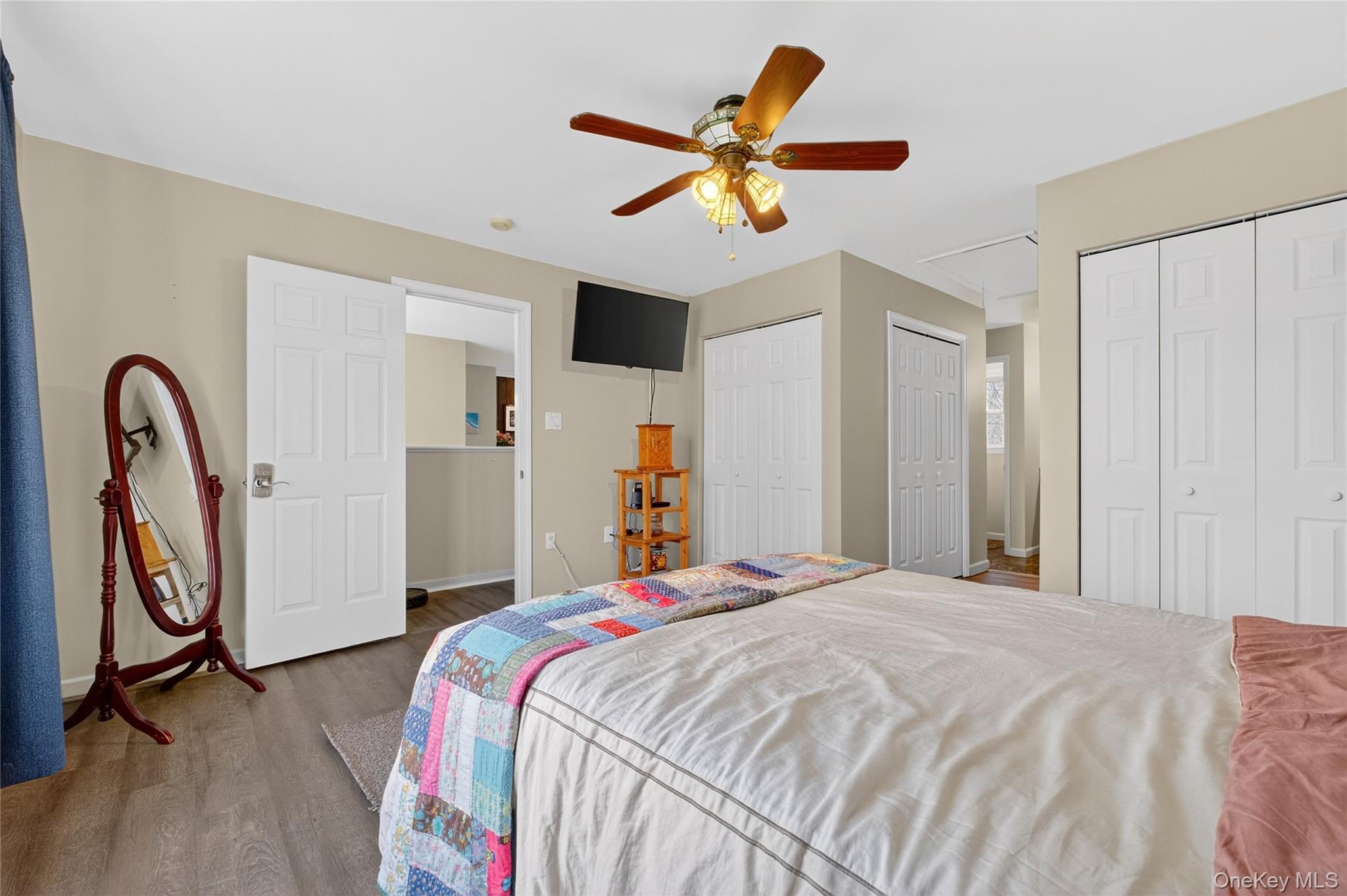 387 Cornwall Hill Road Patterson, NY 12563 - Photo 11 of 43 Upstairs Primary Bedroom with two custom closets with shelving , two walk in closets , attic access, and ceiling fan