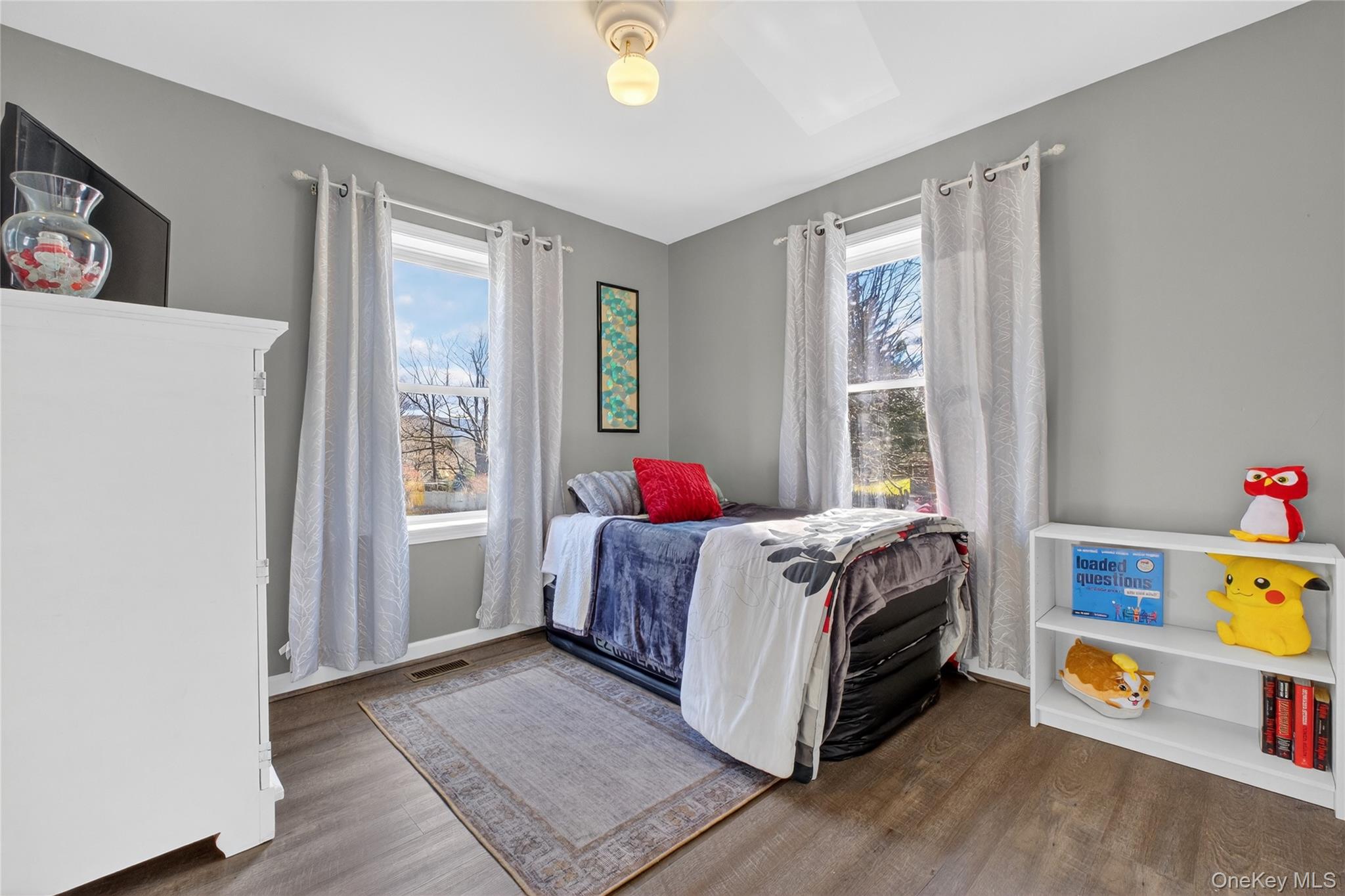 387 Cornwall Hill Road Patterson, NY 12563 - Photo 13 of 43 Bedroom #2 with multiple windows and dark wood finished floors