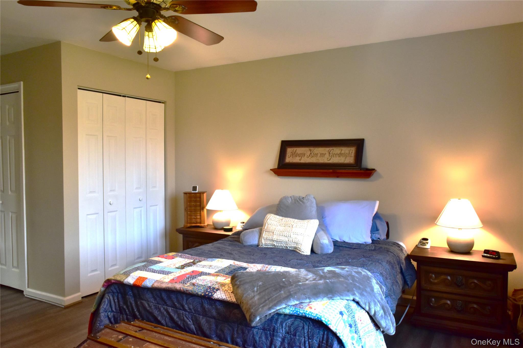 387 Cornwall Hill Road Patterson, NY 12563 - Photo 14 of 50 a bedroom with a bed and a chandelier