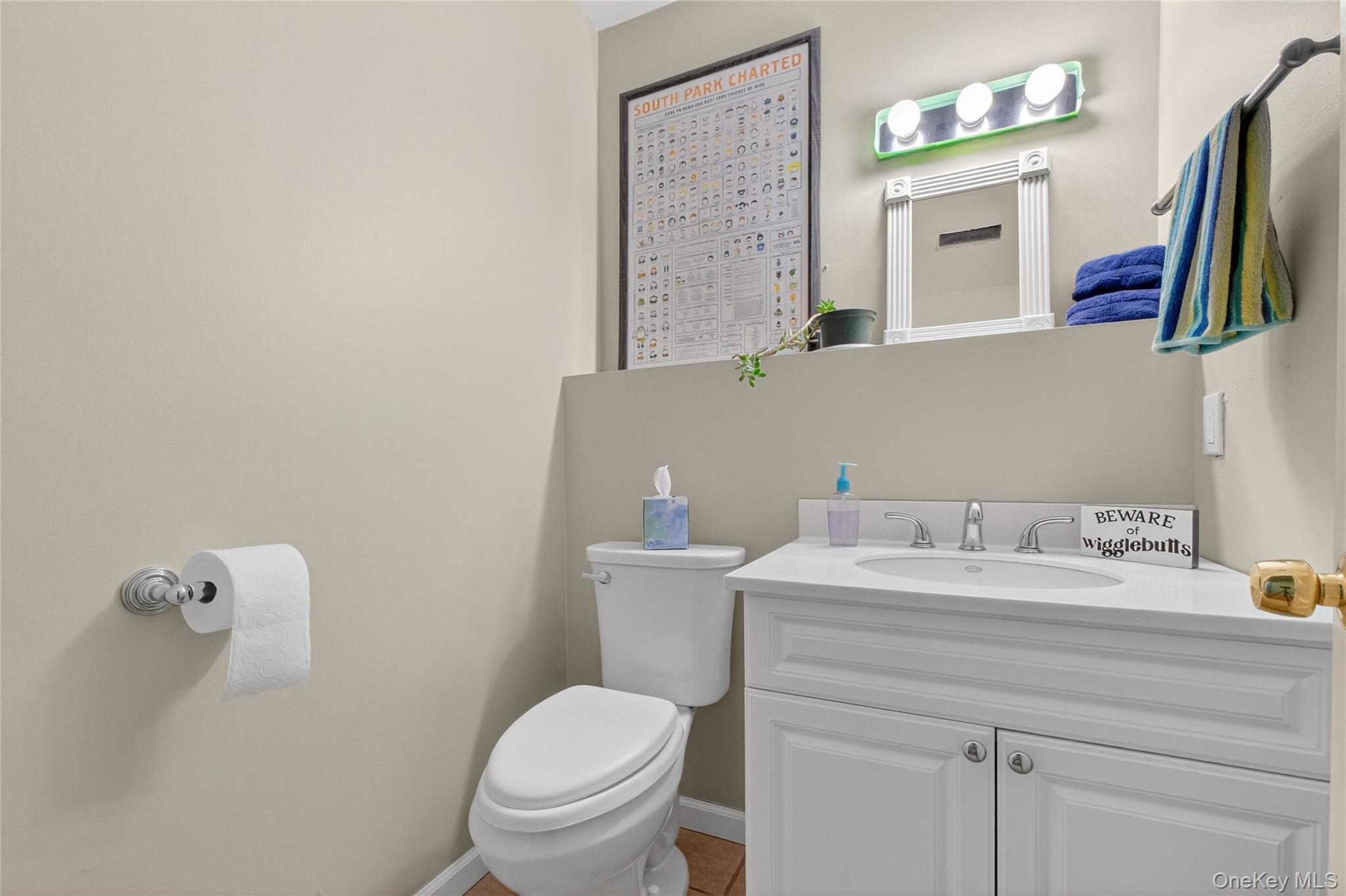 387 Cornwall Hill Road Patterson, NY 12563 - Photo 30 of 50 a bathroom with a sink vanity mirror and toilet