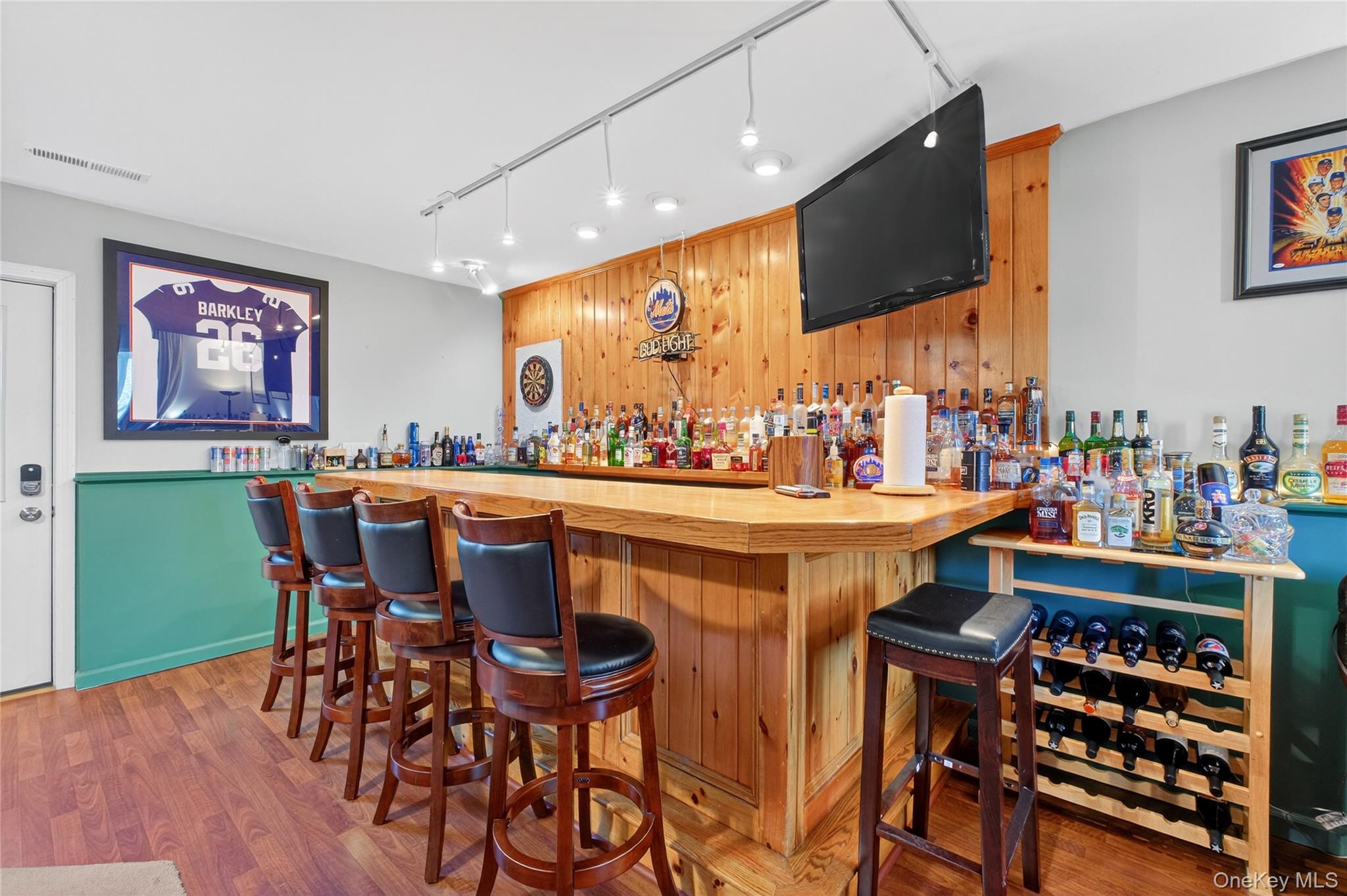 387 Cornwall Hill Road Patterson, NY 12563 - Photo 31 of 47 Bar with wood walls, wooden counters, an accent wall, rail lighting