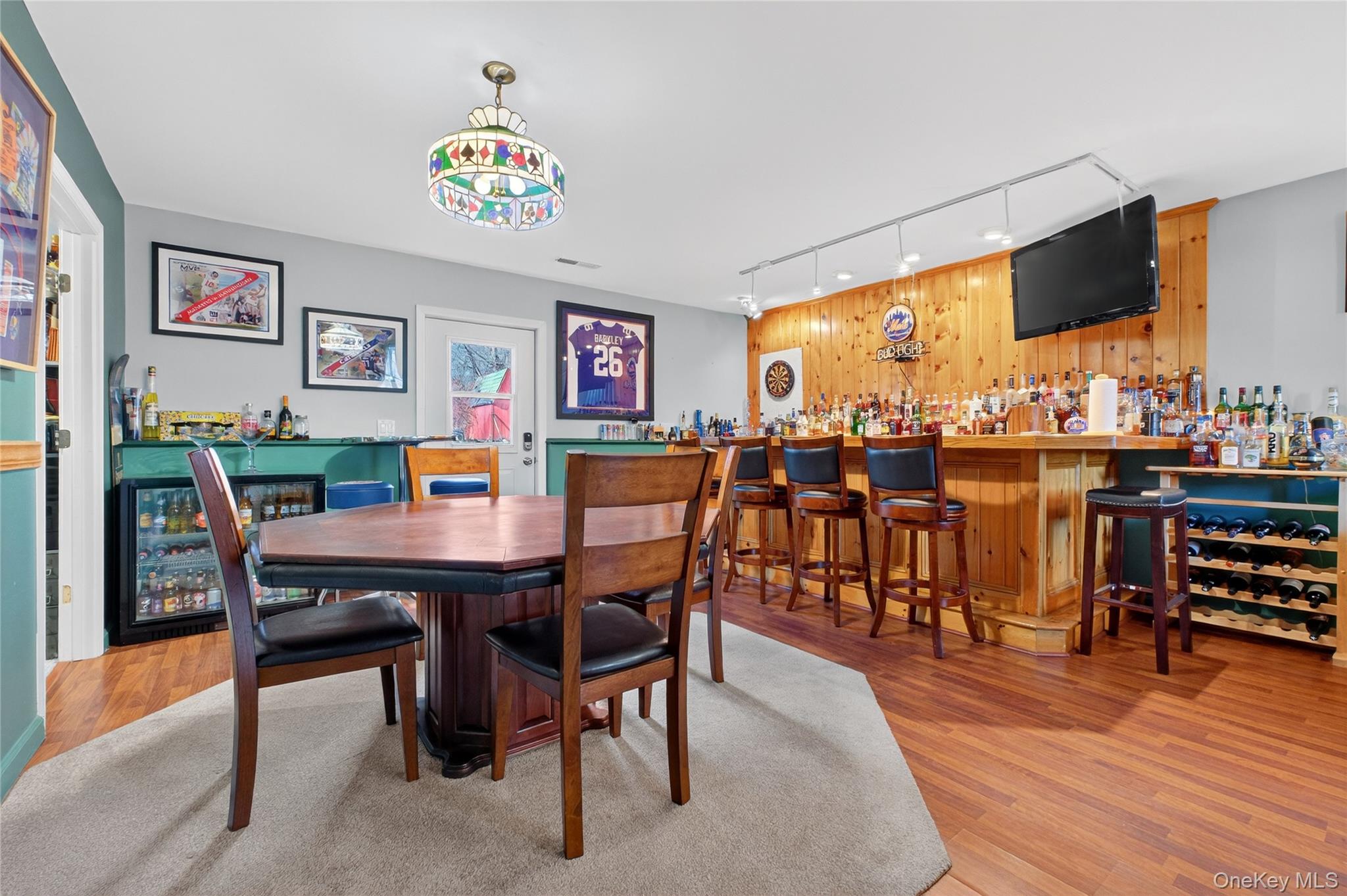 387 Cornwall Hill Road Patterson, NY 12563 - Photo 32 of 50 a view of a dining room with furniture and wooden floor