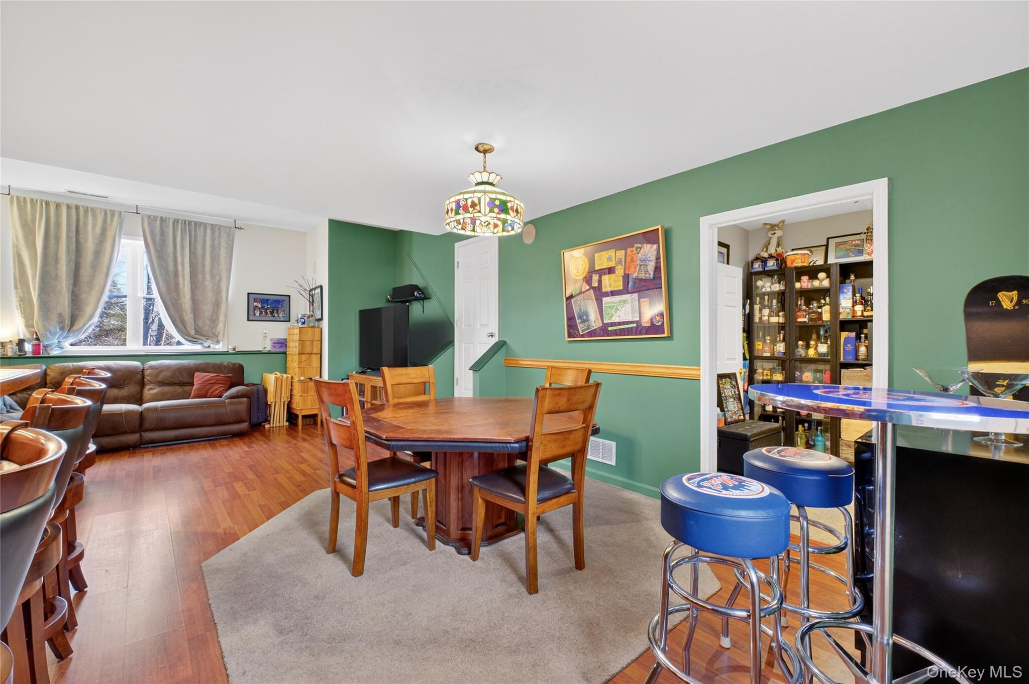 387 Cornwall Hill Road Patterson, NY 12563 - Photo 35 of 50 a view of a dining room with furniture window and wooden floor