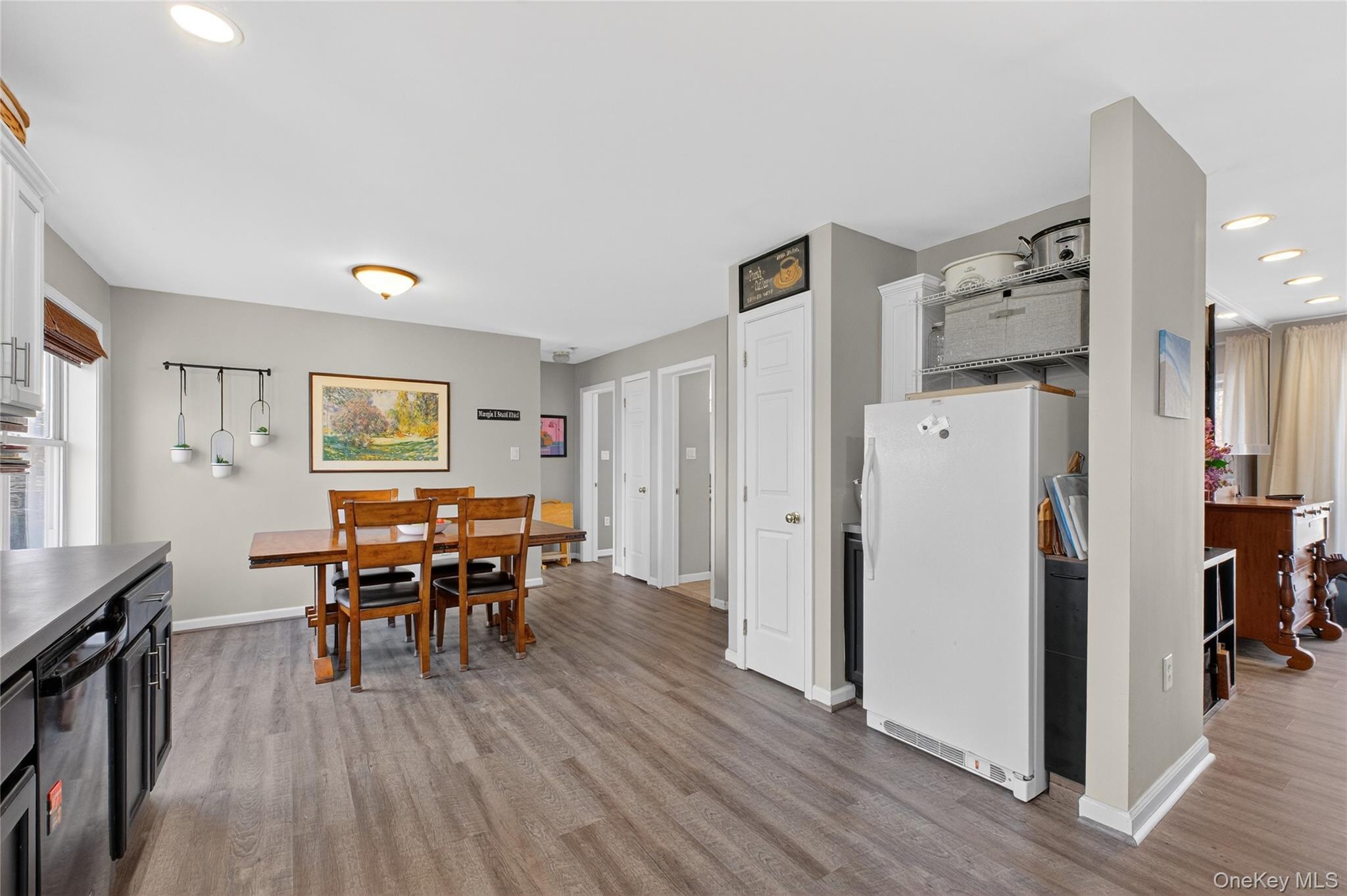 387 Cornwall Hill Road Patterson, NY 12563 - Photo 5 of 47 Upstairs Kitchen with recessed lighting, freestanding refrigerator, light wood-style laminate flooring, and black dishwasher