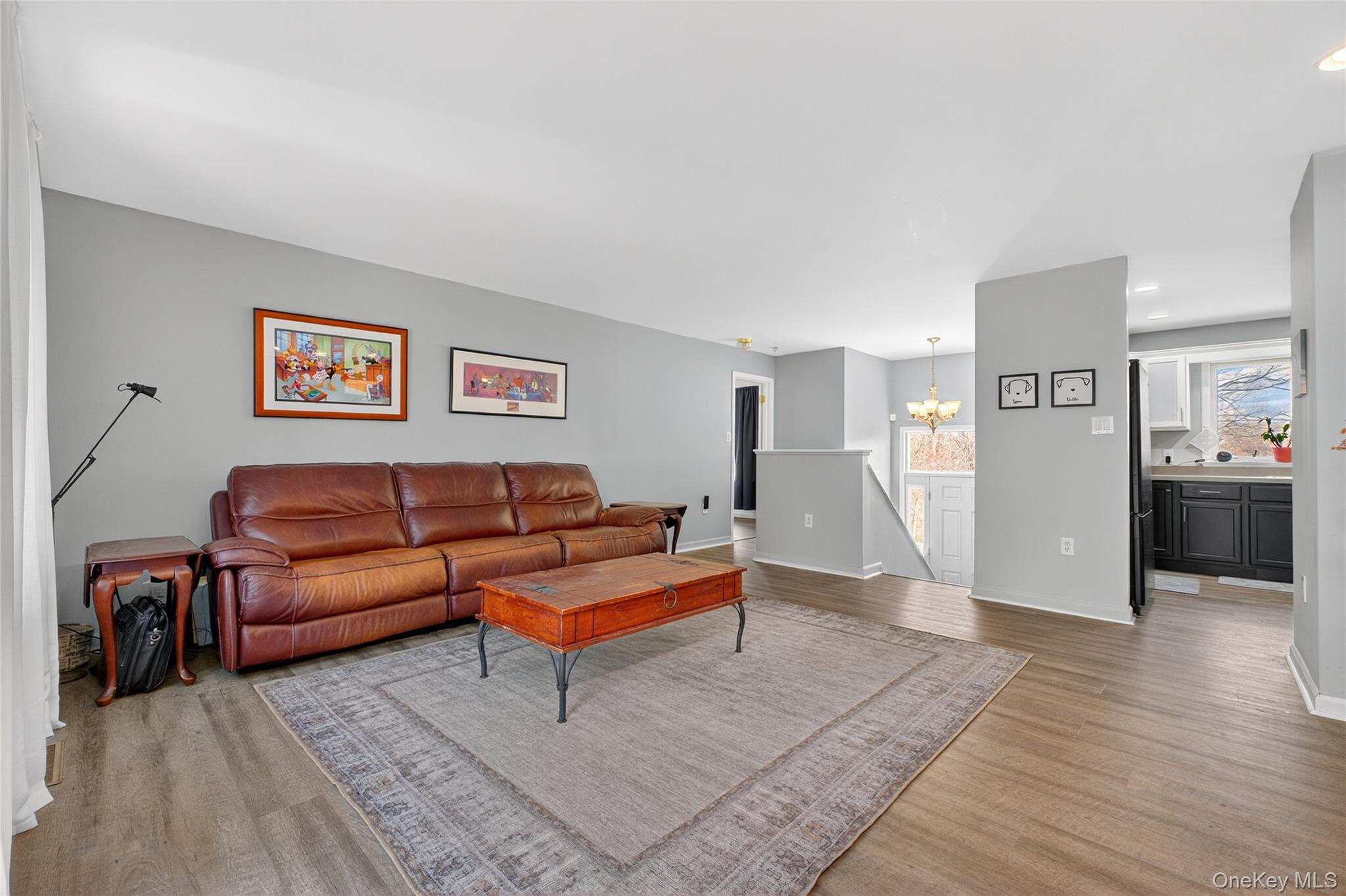 387 Cornwall Hill Road Patterson, NY 12563 - Photo 8 of 47 Living room featuring a chandelier, light wood-style laminate floors, and recessed lighting