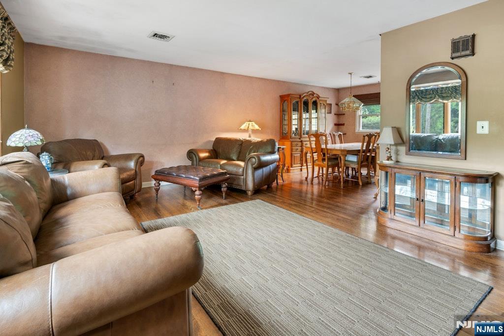 185 Ratzer Road Wayne, NJ 07470 - Photo 9 of 36 a living room with furniture and wooden floor