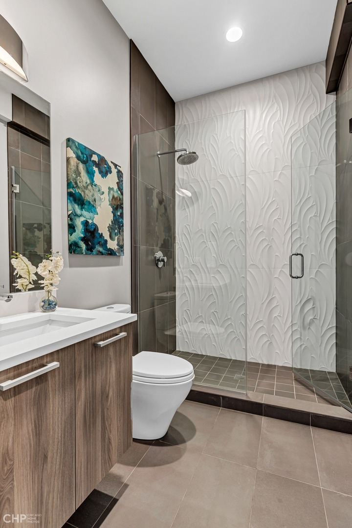 2030 West Rice Street, Unit 2 Chicago, IL 60622 - Photo 14 of 31 a bathroom with a sink a toilet and shower