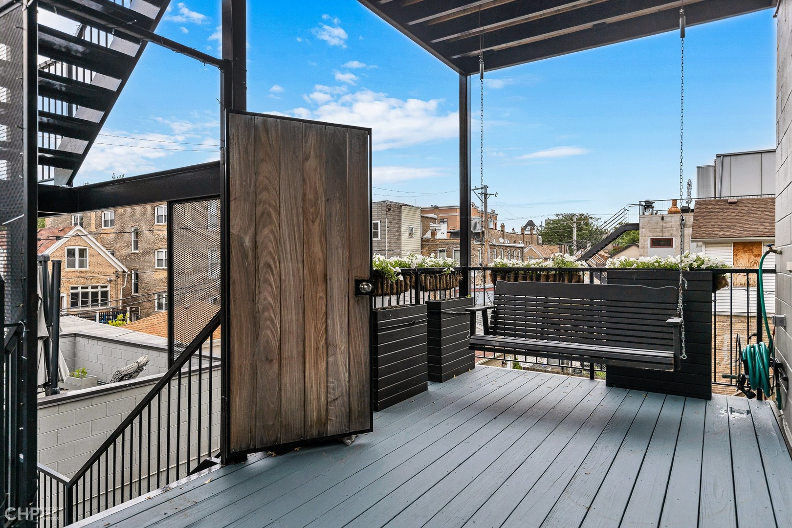 2030 West Rice Street, Unit 2 Chicago, IL 60622 - Photo 15 of 31 a view of a balcony with wooden floor