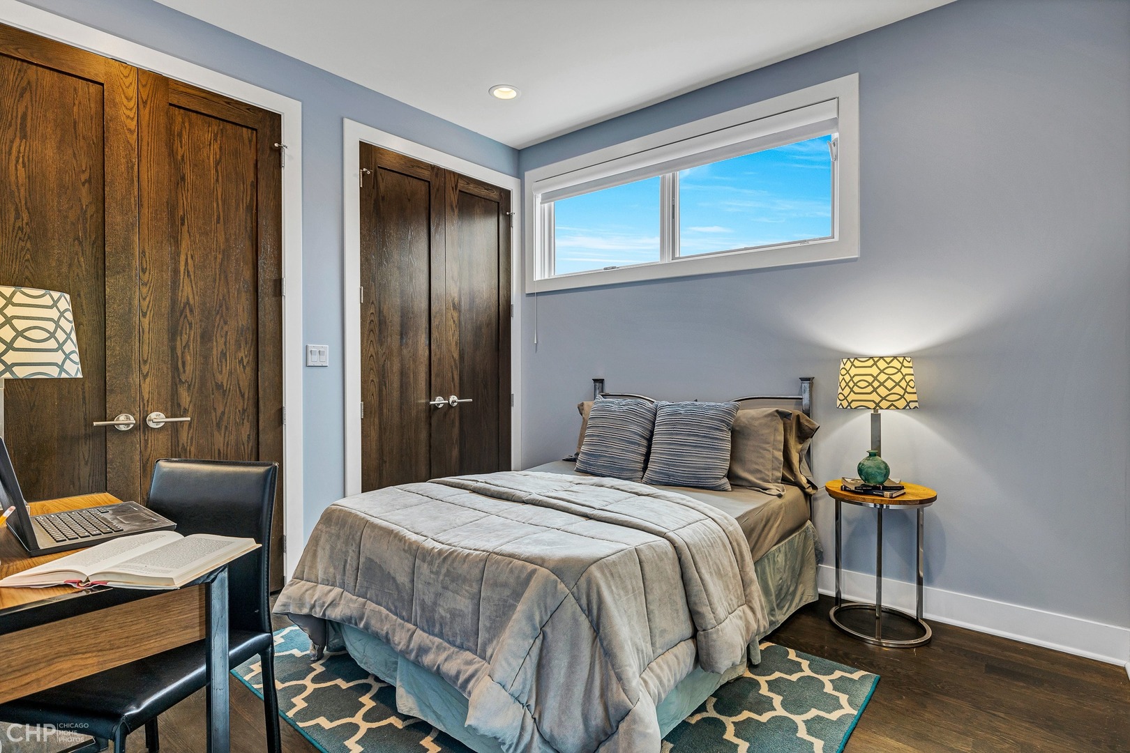 2030 West Rice Street, Unit 2 Chicago, IL 60622 - Photo 24 of 31 a bedroom with a bed and a table