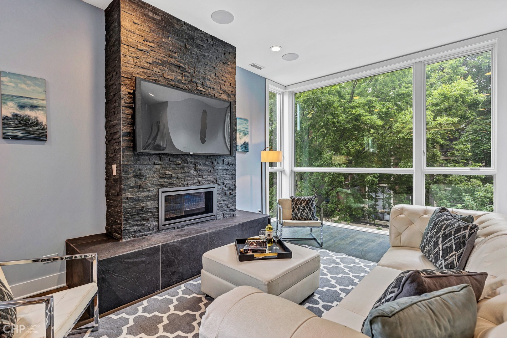 2030 West Rice Street, Unit 2 Chicago, IL 60622 - Photo 6 of 31 a living room with furniture a fireplace and a floor to ceiling window