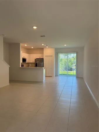 a front view of a house with plants