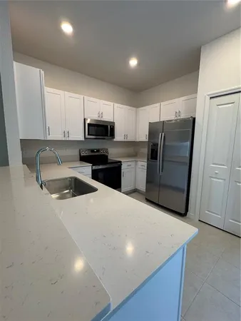 a swimming pool with outdoor seating and garden