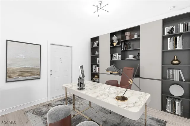 a view of a workspace with furniture