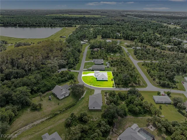 an aerial view of a house with a garden and a yard