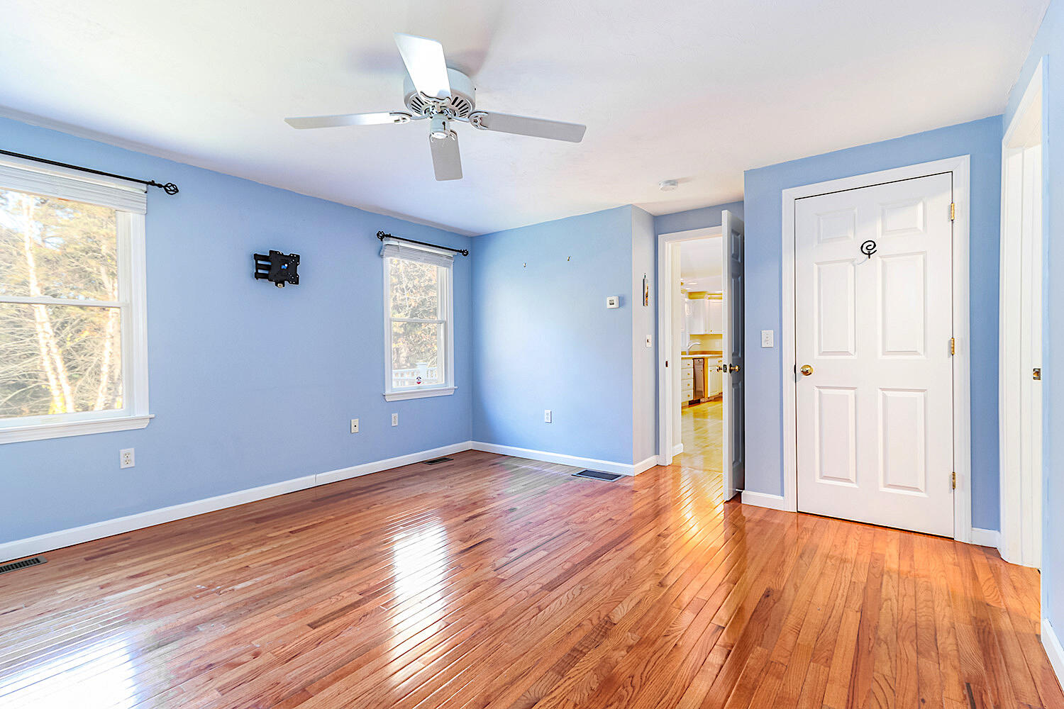 22 Weather Crescent Circle Mashpee, MA 02649 - Photo 13 of 29 an empty room with wooden floor and windows