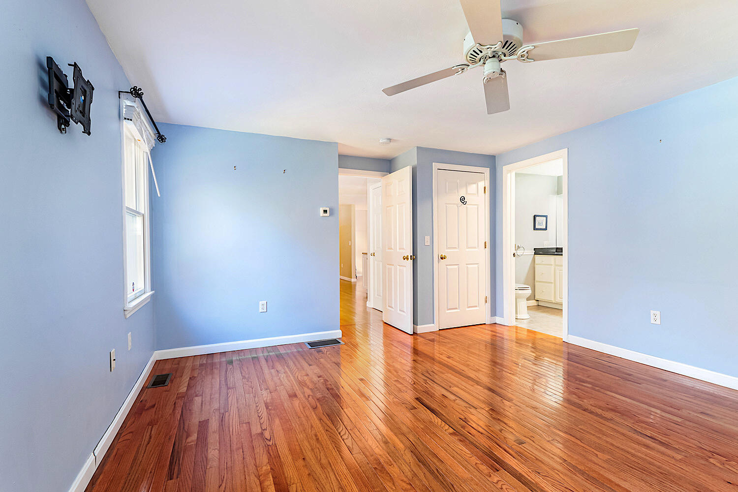 22 Weather Crescent Circle Mashpee, MA 02649 - Photo 14 of 29 a view of an empty room with wooden floor