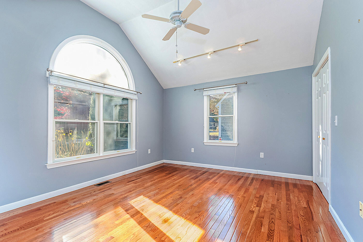 22 Weather Crescent Circle Mashpee, MA 02649 - Photo 17 of 29 a view of empty room with wooden floor and fan