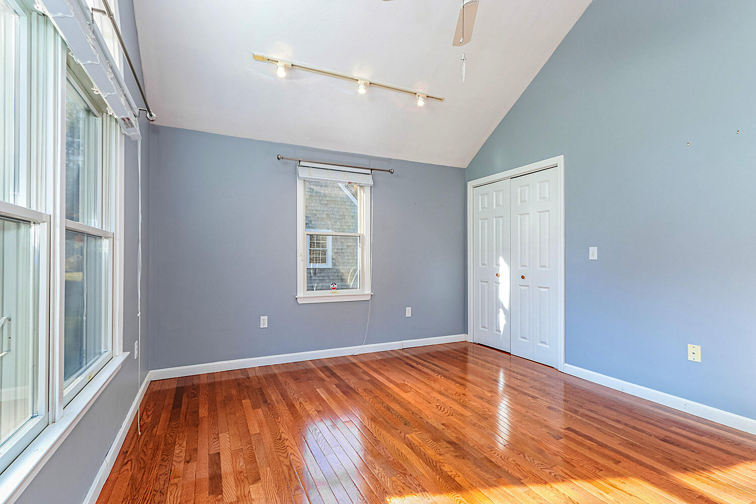 22 Weather Crescent Circle Mashpee, MA 02649 - Photo 18 of 29 a view of empty room with wooden floor and fan