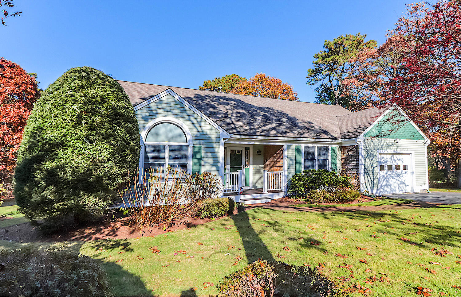 22 Weather Crescent Circle Mashpee, MA 02649 - Photo 2 of 29 a front view of a house with a yard