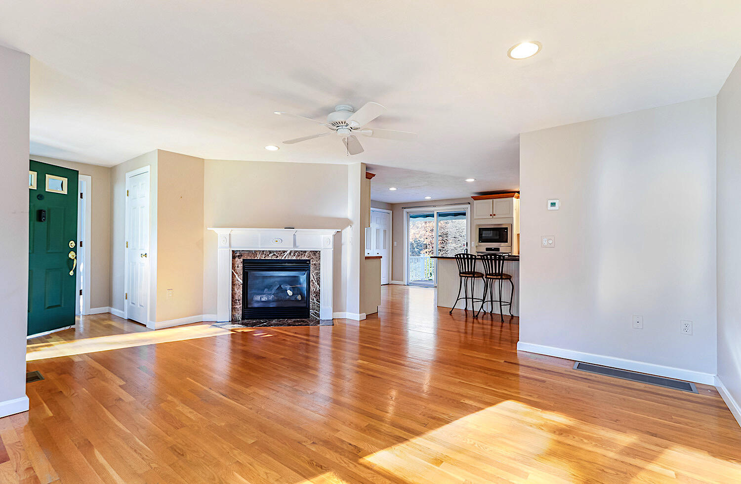 22 Weather Crescent Circle Mashpee, MA 02649 - Photo 7 of 29 a living room with fireplace and a wooden floor