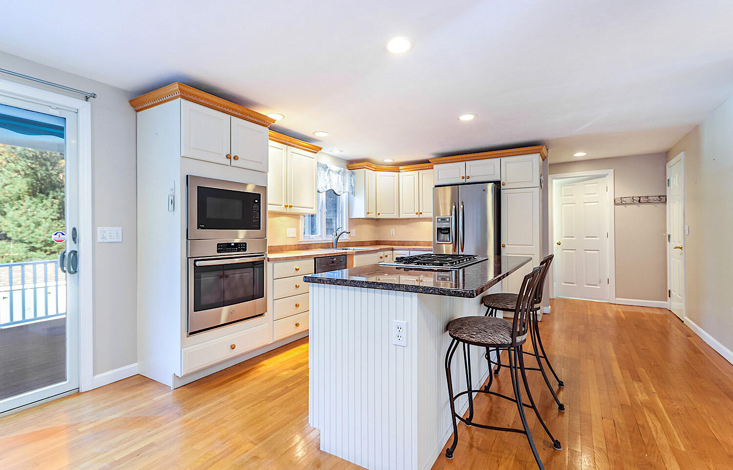 22 Weather Crescent Circle Mashpee, MA 02649 - Photo 9 of 29 a kitchen with stainless steel appliances a stove a refrigerator and a sink