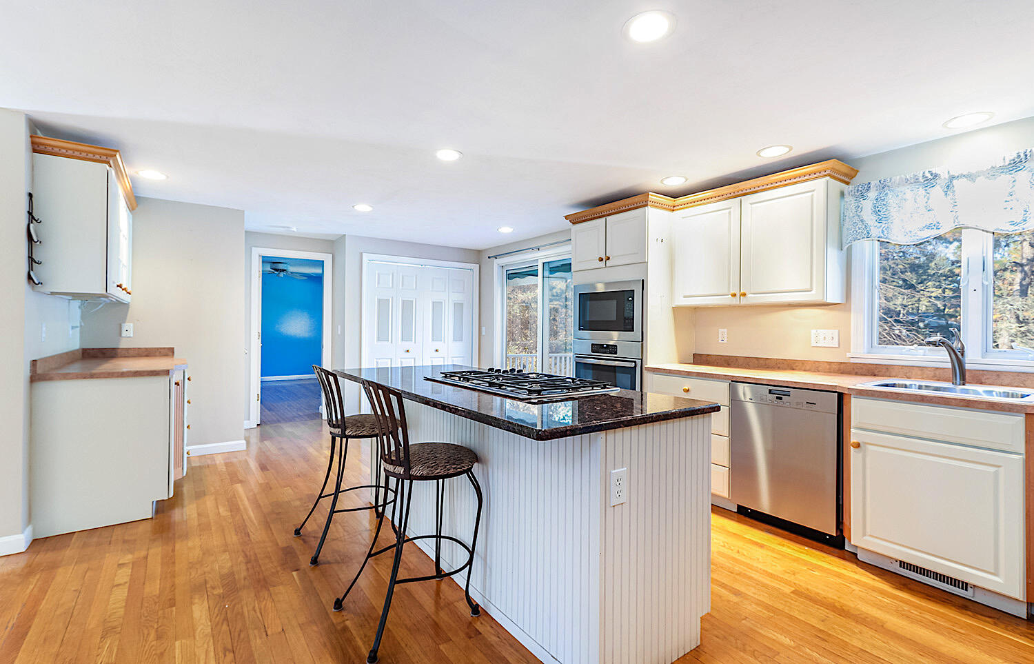 22 Weather Crescent Circle Mashpee, MA 02649 - Photo 10 of 29 a kitchen with stainless steel appliances granite countertop a stove and a refrigerator