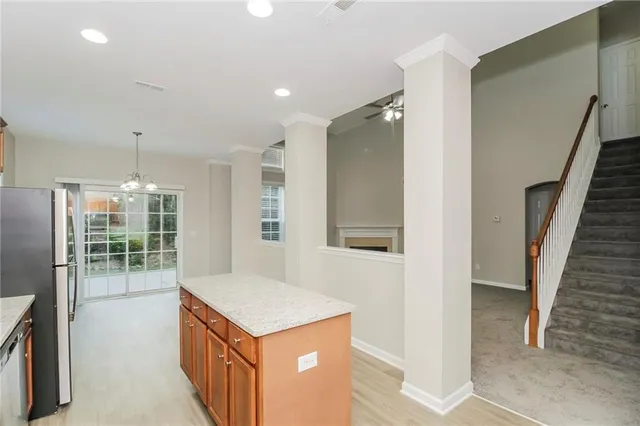a kitchen with a stove a refrigerator and a sink