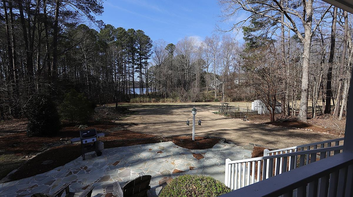 6133 View Water Drive Raleigh, NC 27606 - Photo 30 of 43 Landscaped yard and open fields