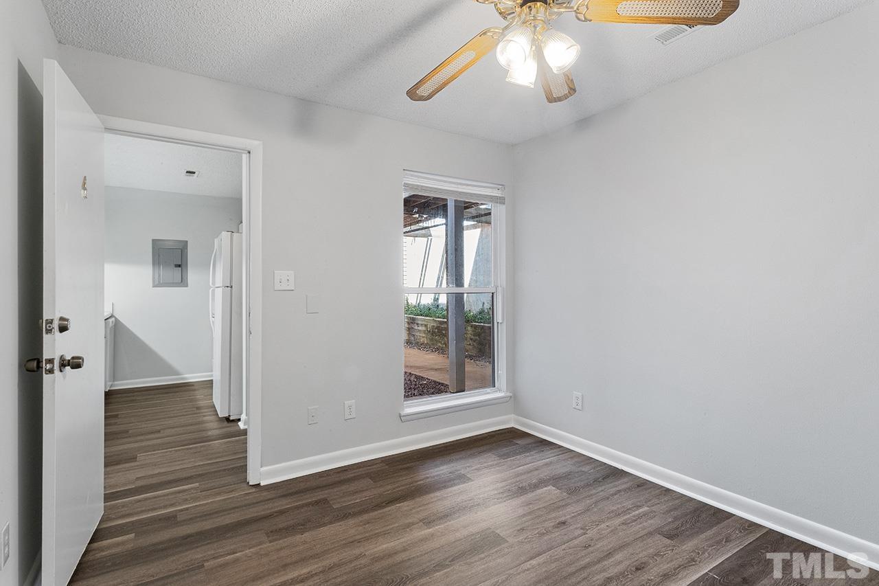 1241 University Court, Unit 2 Raleigh, NC 27606 - Photo 12 of 34 wooden floor in an empty room with a window