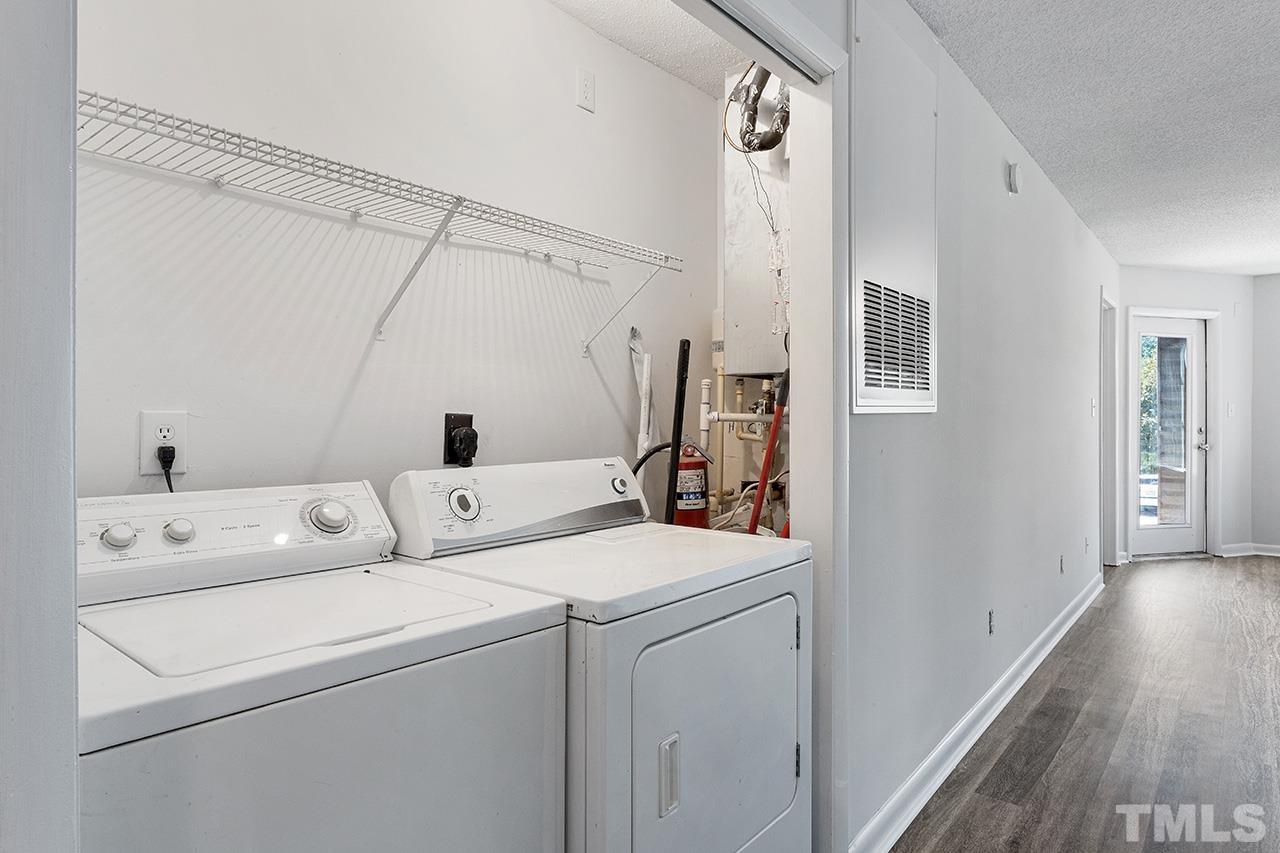1241 University Court, Unit 2 Raleigh, NC 27606 - Photo 14 of 34 a view of washer and dryer with wooden floor