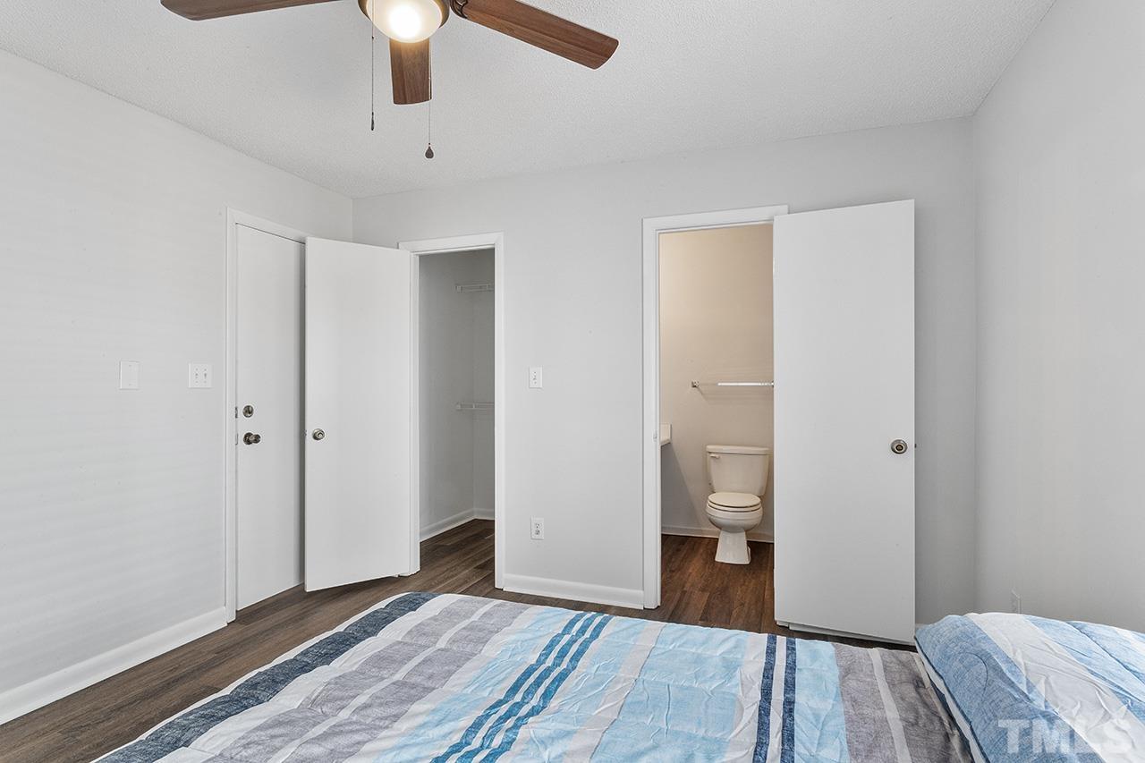 1241 University Court, Unit 2 Raleigh, NC 27606 - Photo 18 of 34 a view of a room with wooden floor and bedroom