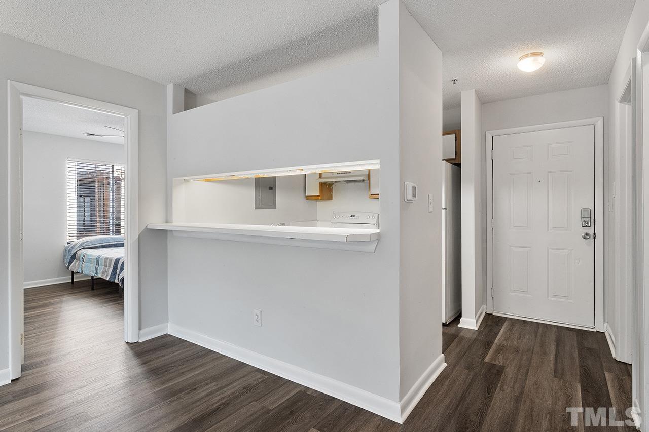1241 University Court, Unit 2 Raleigh, NC 27606 - Photo 2 of 34 a view of hallway with wooden floor