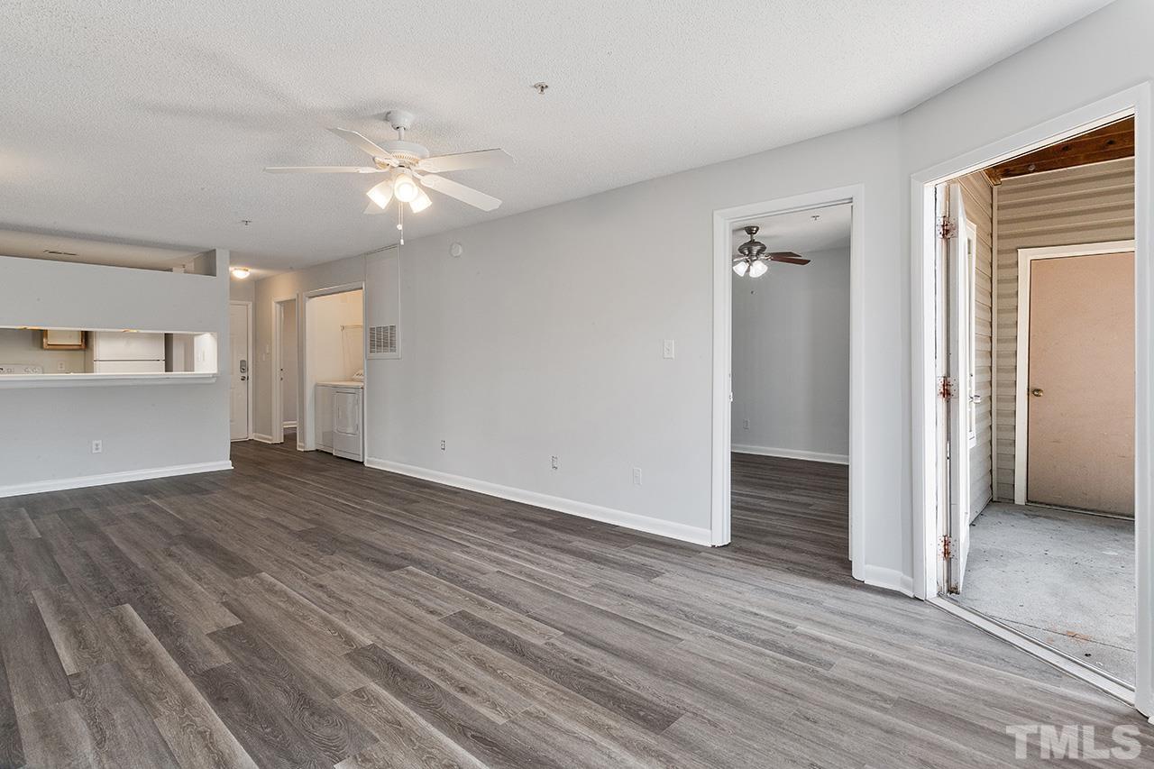 1241 University Court, Unit 2 Raleigh, NC 27606 - Photo 24 of 34 wooden floor in an empty room with a window