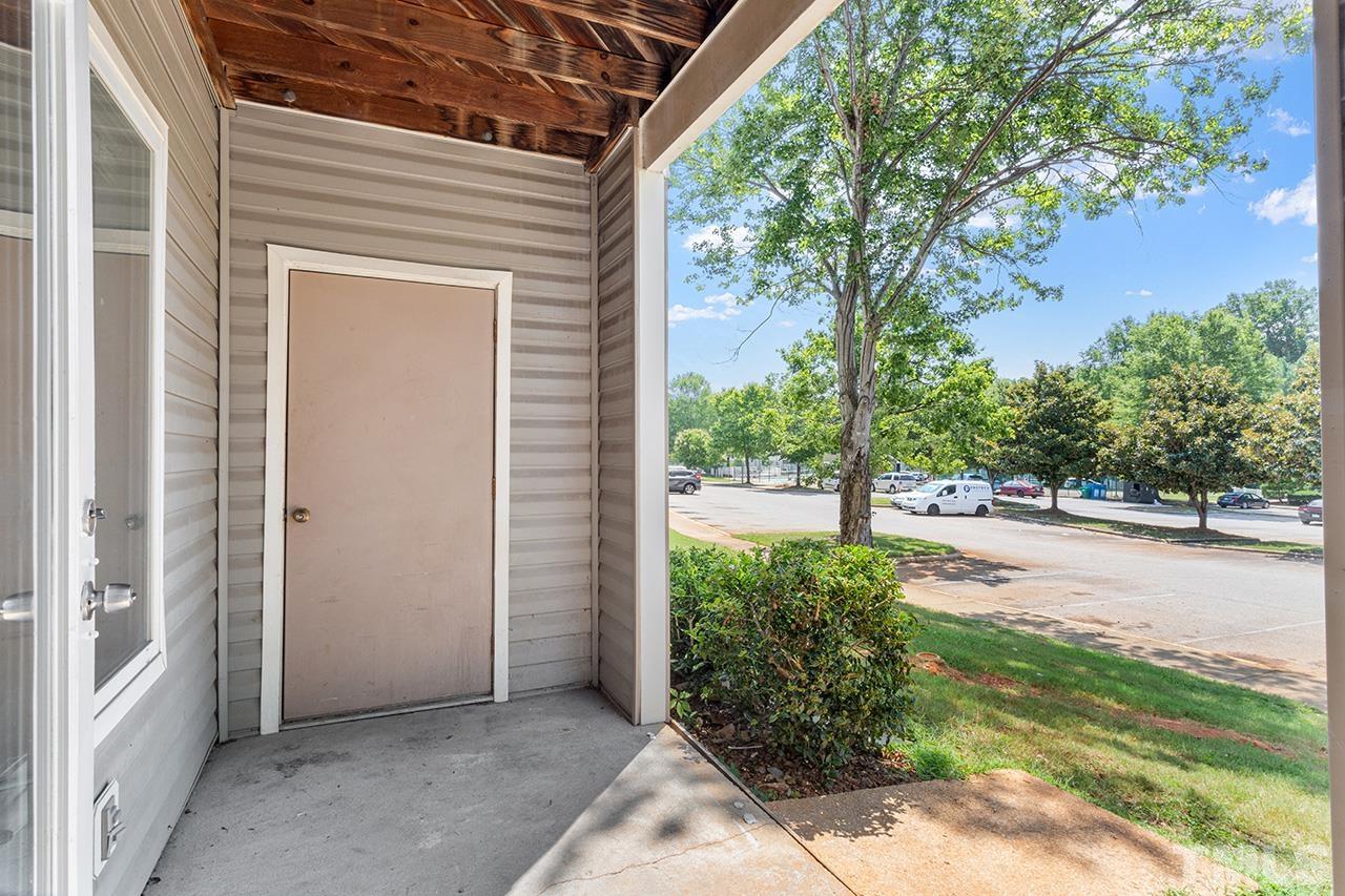 1241 University Court, Unit 2 Raleigh, NC 27606 - Photo 25 of 34 a view of a house with backyard and garden