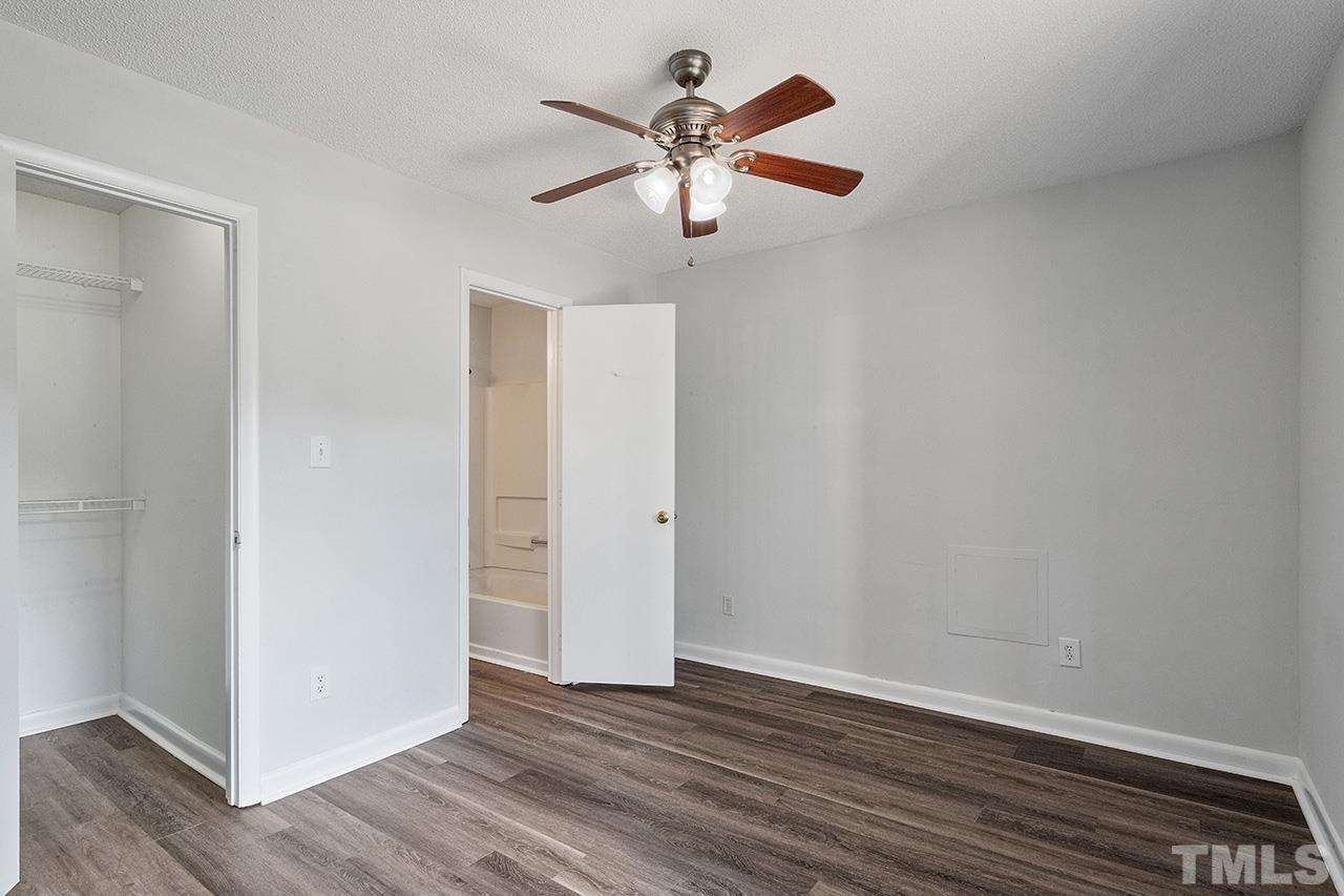 1241 University Court, Unit 2 Raleigh, NC 27606 - Photo 26 of 34 a view of an empty room with wooden floor