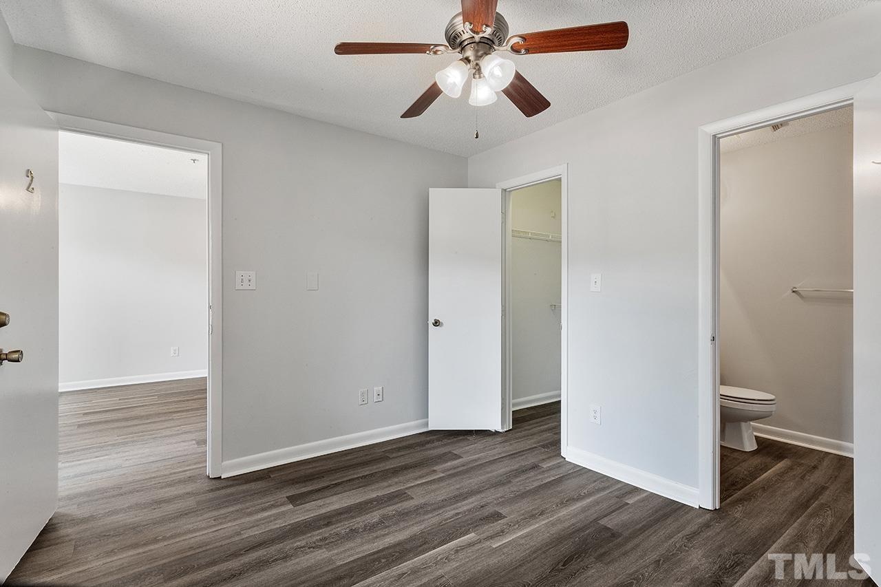 1241 University Court, Unit 2 Raleigh, NC 27606 - Photo 27 of 34 wooden floor in an empty room with a bathroom