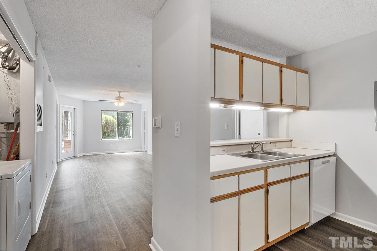 1241 University Court, Unit 2 Raleigh, NC 27606 - Photo 4 of 34 a kitchen with a sink cabinets and wooden floor