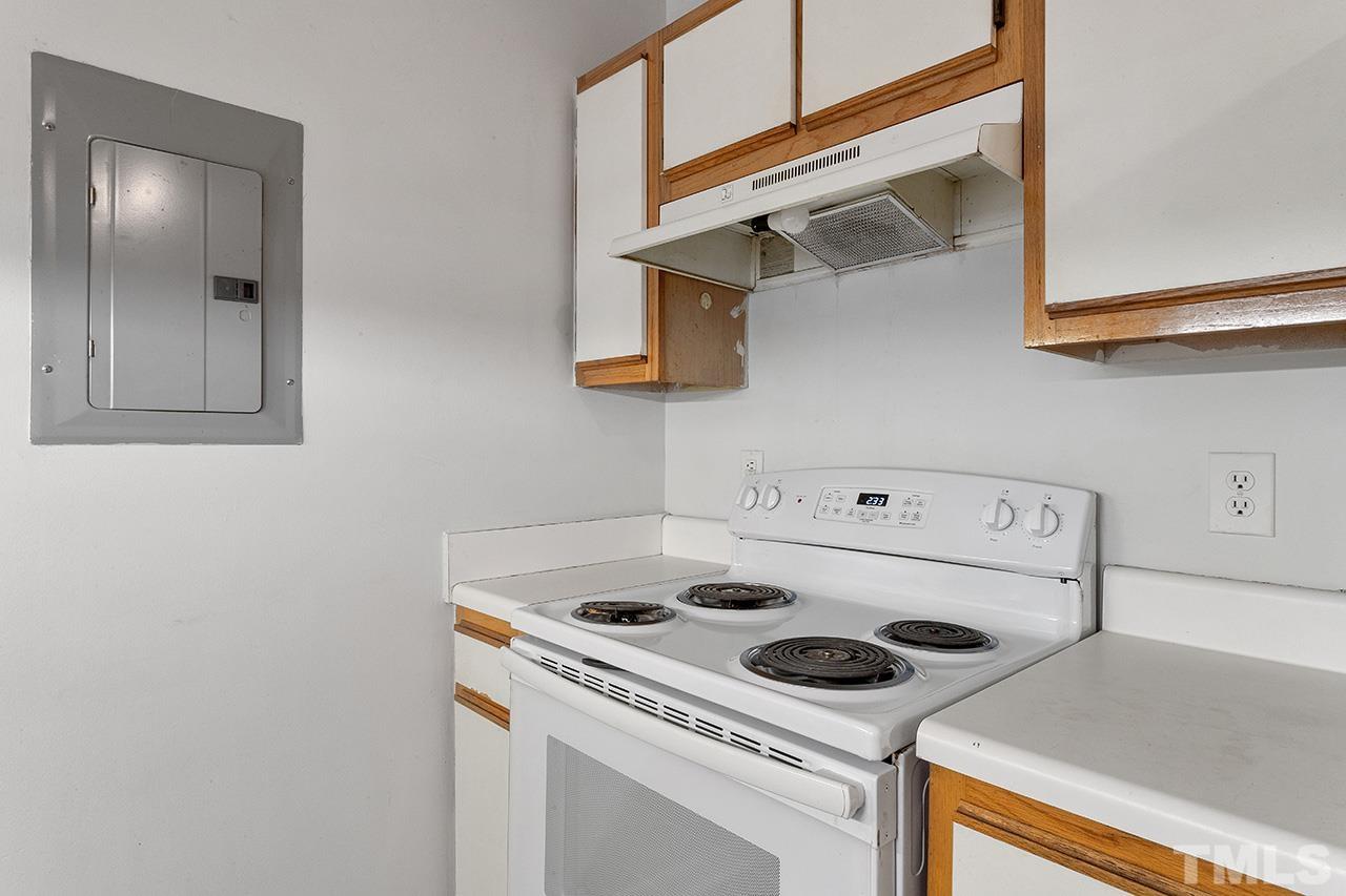 1241 University Court, Unit 2 Raleigh, NC 27606 - Photo 6 of 34 a white stove top oven sitting inside of a kitchen