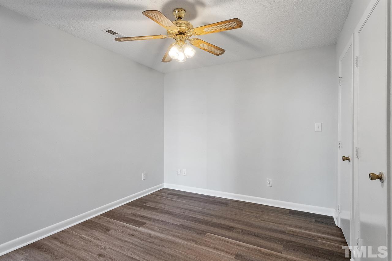1241 University Court, Unit 2 Raleigh, NC 27606 - Photo 9 of 34 a view of an empty room with wooden floor