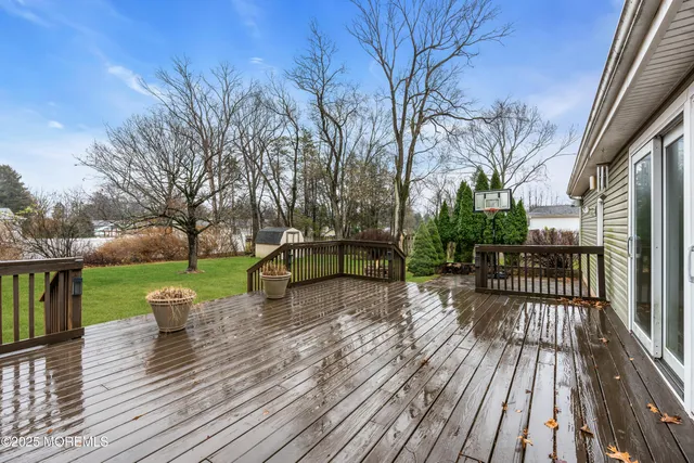 a park view with a bench next to a yard