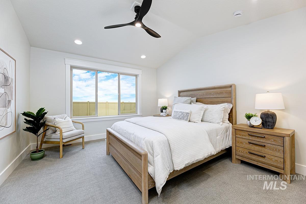 6975 South Skybreak Lane Meridian, ID 83642 - Photo 10 of 29 Bedroom with lofted ceiling, light colored carpet, ceiling fan, and recessed lighting