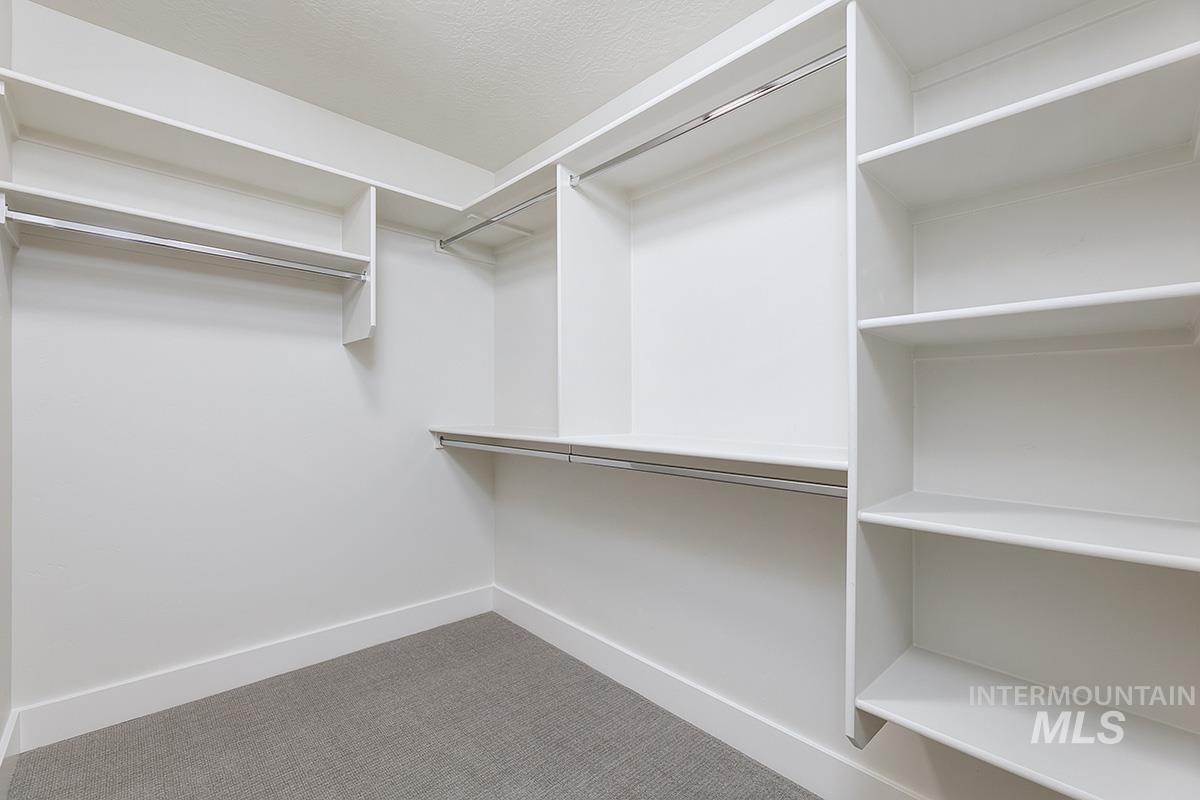 6975 South Skybreak Lane Meridian, ID 83642 - Photo 15 of 29 Walk in closet featuring light carpet